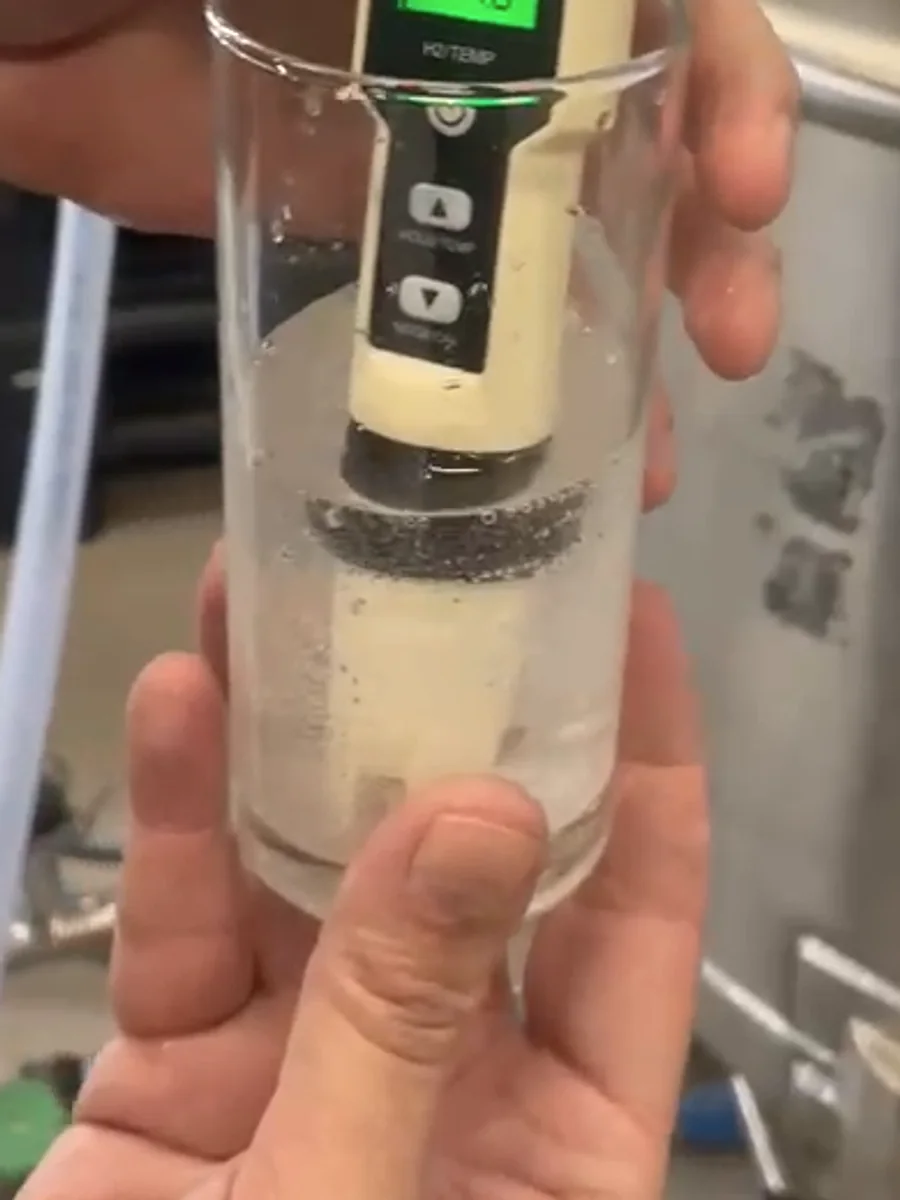 Cropped sample showing a cloudy hydrogen-rich beverage with a dense population of visible white microbubbles.